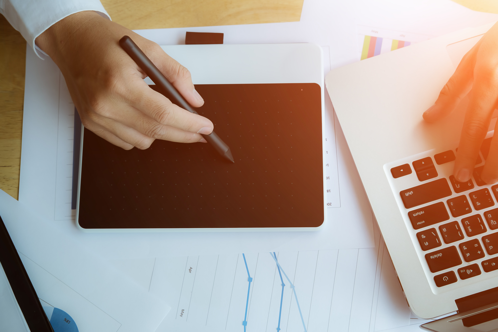 Top View of a Graphic Designer Drawing on Digital Pad